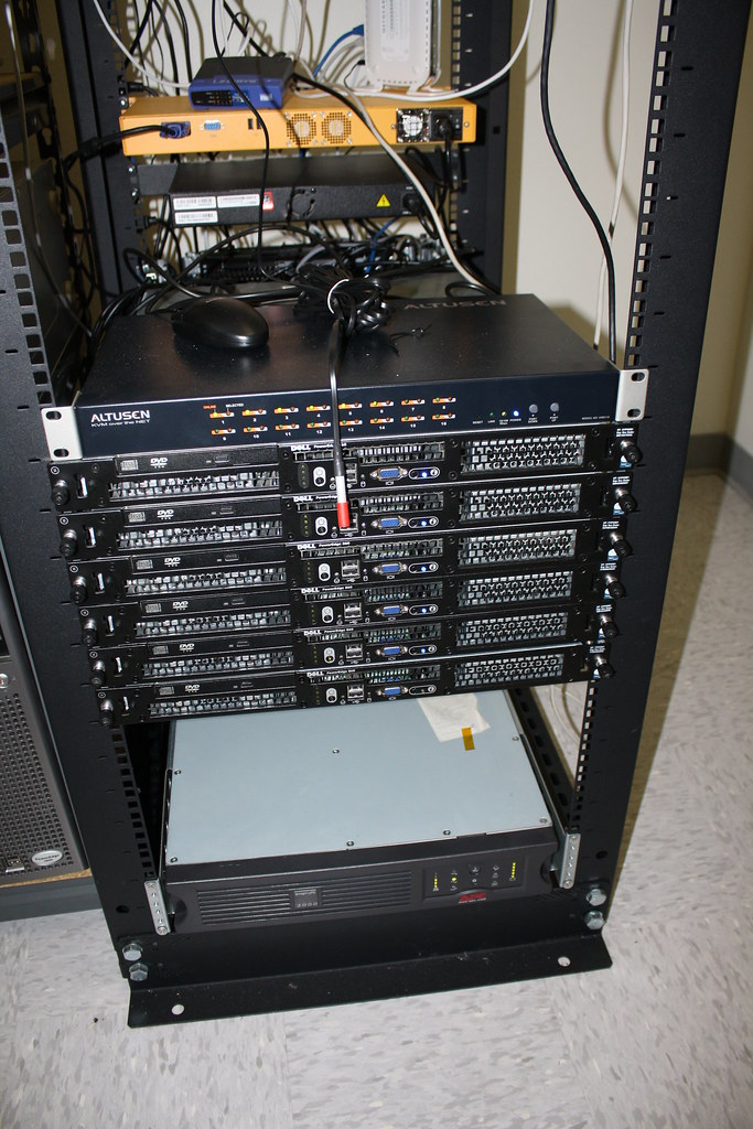 Open two-post rack with a few servers and network switches